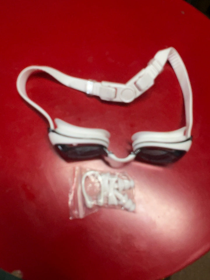 White strap swimming goggles with dark lenses and accessory bag